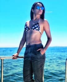 Actress Surveen Chawla looks HOT as she pairs BIKINI with a formal pant in latest pics!