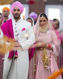 IN PICS: Newlywed Neha Dhupia flaunts her mehendi & chooda as she leaves for HONEYMOON with hubby Angad Bedi soon after their PRIVATE WEDDING!