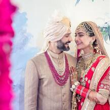 IN PICS: Newlywed Sonam Kapoor leaves for Cannes with hubby Anand Ahuja! Check out their in-flight ROMANCE!