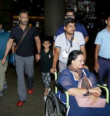 IN PICS: Ajay Devgn spotted with son Yug & mother Veena at the airport!