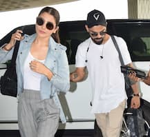Anushka & Virat get snapped at Airport TWINNING in white sneakers!