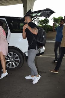 IN PICS: Virat Kohli HUGS wife Anuhska Sharma at the airport before leaving for Delhi!