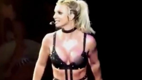 Britney Spears flashes her nipple covers as her bra slips down