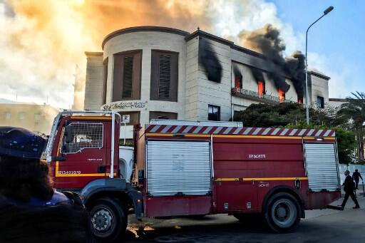 At least three people were killed and 10 others, including a paramedic, were injured in a terror attack on the Libyan Foreign Ministry's headquarters in the capital on Tuesday, the Health Ministry said./ (Photo by Mahmud TURKIA / AFP)