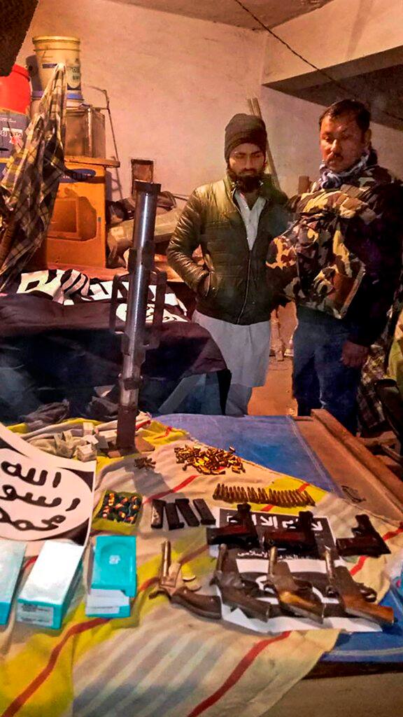 During the searches, the agency recovered a huge cache of handmade weapons, including a yet to be tested rocket launcher, material for suicide vests, 12 locally made pistols, hundreds of live rounds of bullets, 100 mobiles and 135 SIM cards. (PTI Photo)