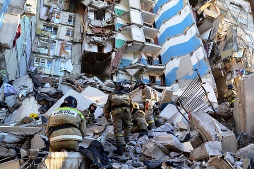 attling freezing temperatures, rescuers have been combing through piles of mangled concrete and metal and trying to stabilise what remains of the walls in the Soviet-era apartment block, which had been home to about 1,100 people.. (Photo by HO / RUSSIAN EMERGENCY SITUATIONS MINISTRY / AFP) 