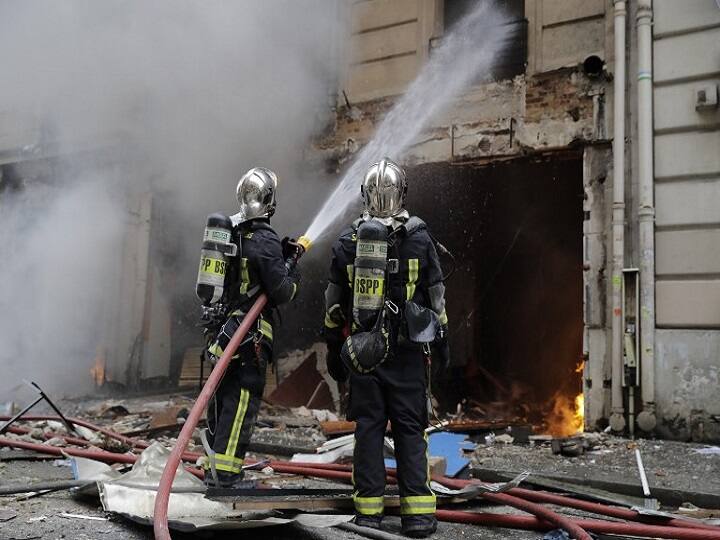 Firefighters worked to extinguish the blaze and exacuate some people from the building using ladders while emergency workers treated some of the injured at the scene. / AFP IMAGE