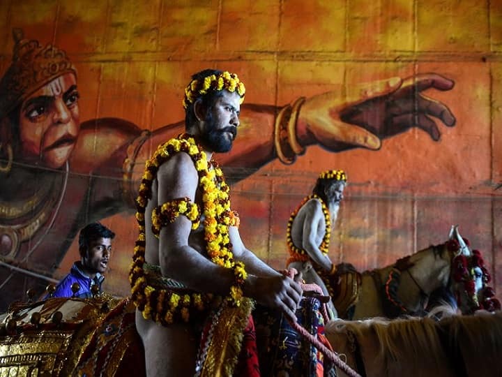 Kumbh Meal 2019: Naked sadhus (Hindu holy men) ride horses as they take part in a religious procession towards the Sangam area during the 'royal entry' for the upcoming Kumbh Mela festival in Allahabad on January 4, 2019. (AFP)