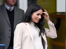 IN PICTURES: Pregnant Meghan Markle flaunts baby bump as she steps out in $35 dress