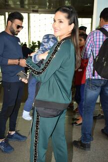 Sunny Leone gets snapped with twin sons Asher, Noah at Airport & the pictures are too adorable!