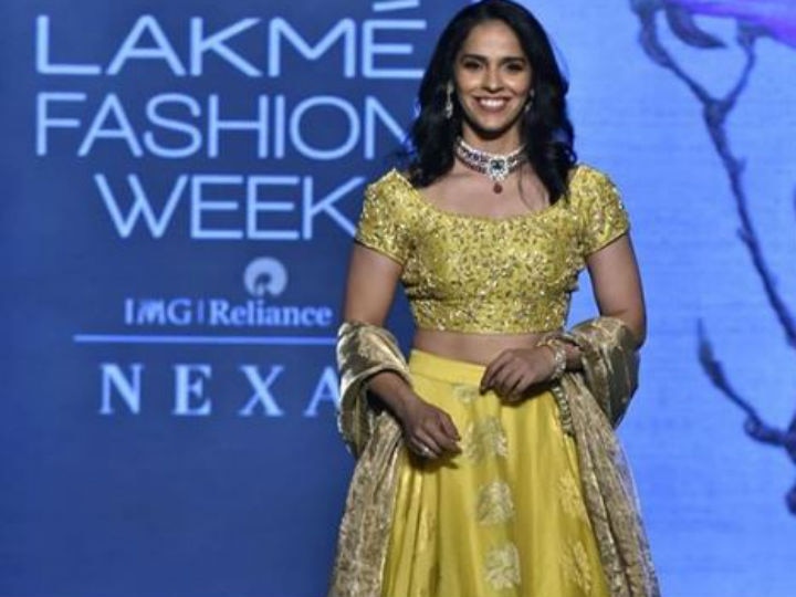 Saina Nehwal glows in yellow at Lakme Fashion Week! Lakme Fashion Week 2019: Badminton star Saina Nehwal glows in yellow on the ramp; SEE PICS