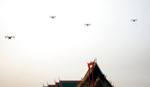 A political storm has also arisen in Bangkok with critics calling the drones a meaningless stunt. Governor Asawin acknowledged that drones aren't a long-term solution but said he thinks every bit of effort helps, but he also said that those critising him for drones, would otherwise criticize him for doing nothing. (AP Photo/Sakchai Lalit)