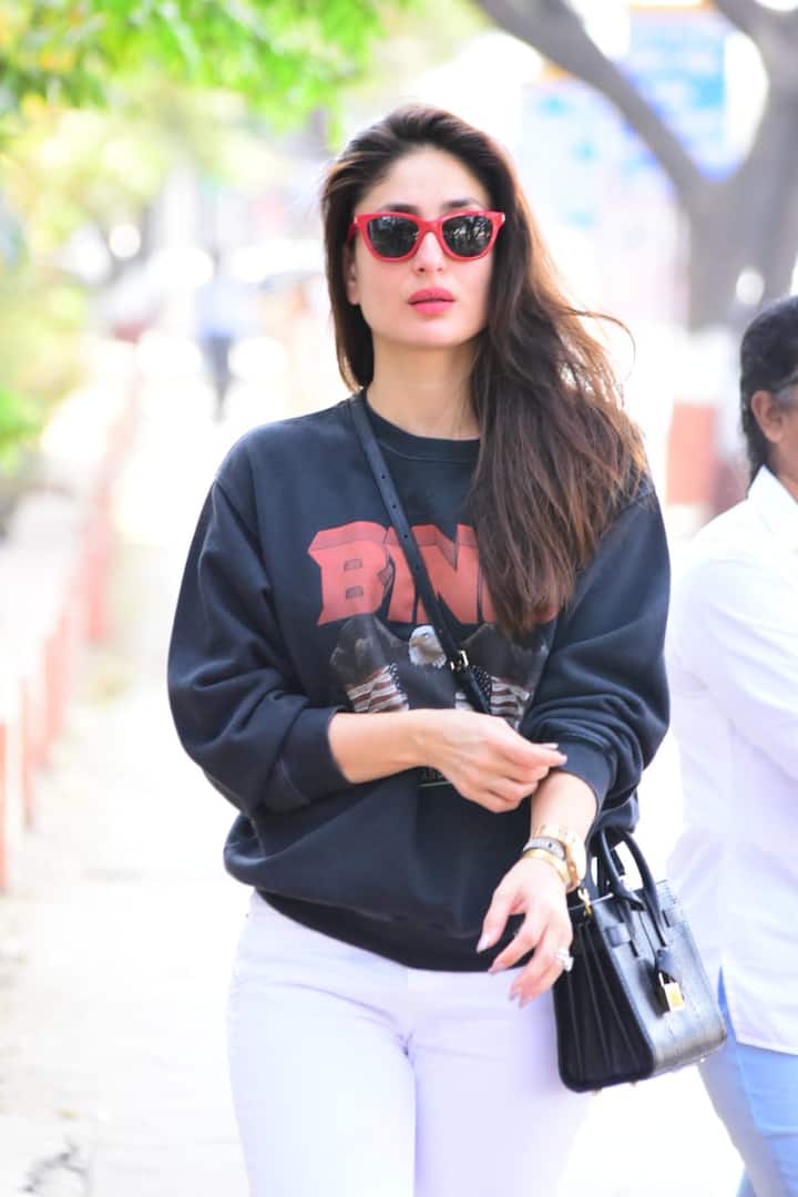 She left her tresses opened and was wearing big glasses and was carrying a black sling bag 