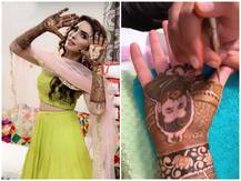 PICS-VIDEO: Mansi Sharma gets beau Yuvraj Hans\' face drawn with henna on her hand during mehendi ceremony!