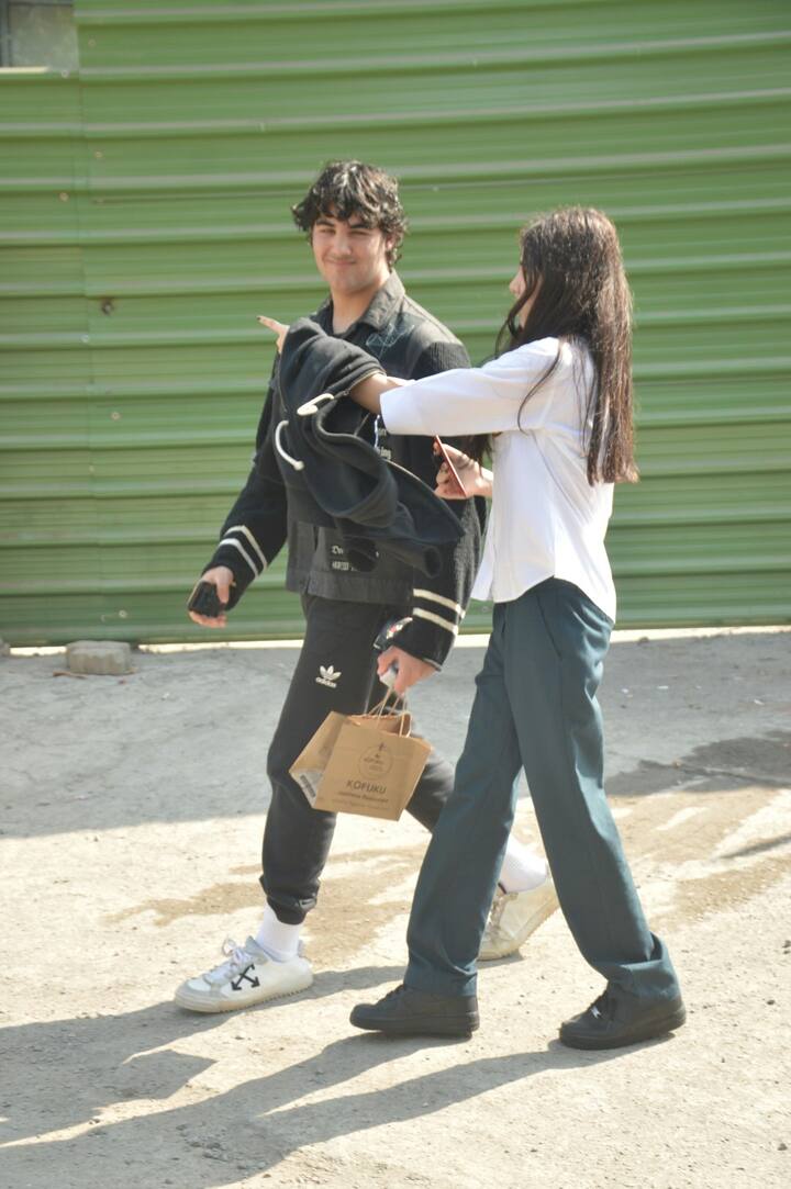 The boy who otherwise seems to be shy also smiled for the shutterbugs this time