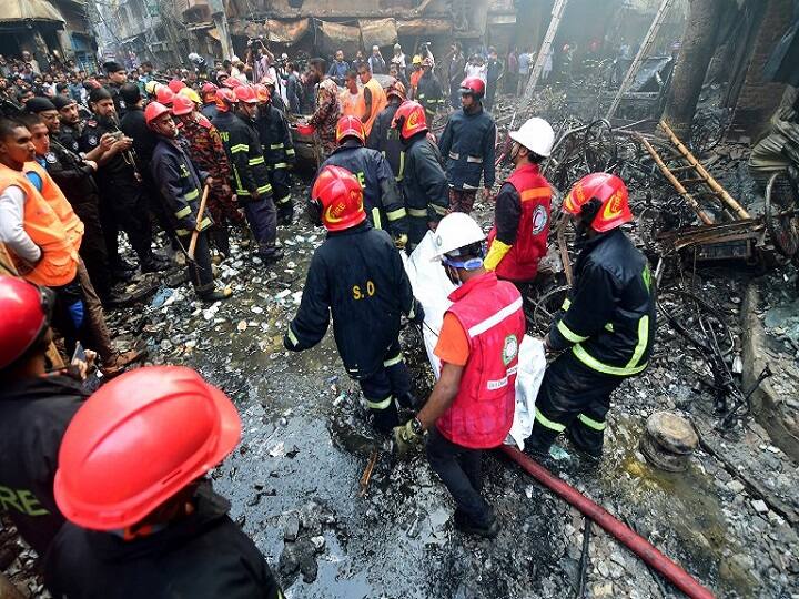 Rescue personnel carry the body of a victim after a fire broke out in Dhaka. (AFP)