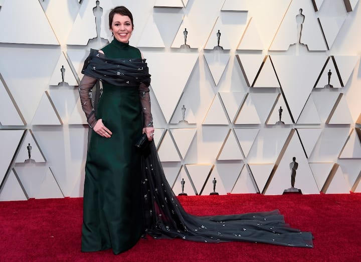 Olivia Colman who won the best actress award in a leading role posing at the red carpet