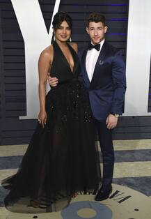 PICS: Priyanka Chopra turns heads in a black plunging neck gown posing beside hubby Nick Jonas at 2019 Vanity Fair Oscar party!