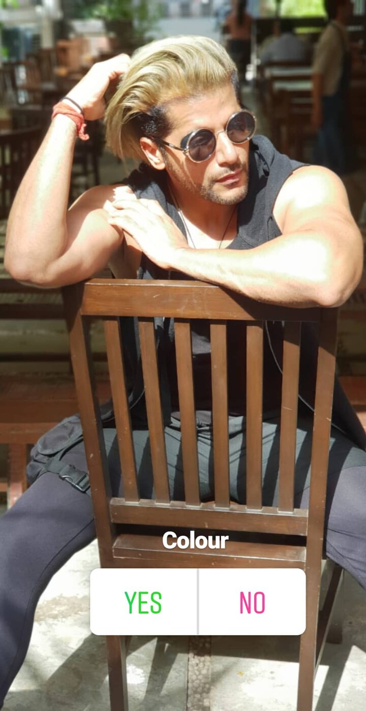 Karanvir Bohra poses in his new blonde hair