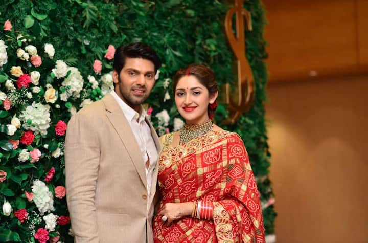 Sayyeshaa looked elegant in a Gujarati saree while Arya looked dapper in a suit.