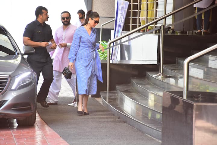 Kareena Kapoor Khan looked every bit of a yummy-mummy in a blue striped wrap-around midi dress with bishop sleeves. 