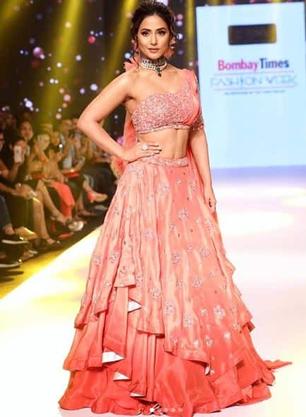 Hina Khan recently turned heads when she walked the ramp at the Bombat Times Fashion Week in a stunning coral lehenga. 