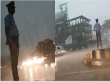 WATCH: This traffic police constable mans traffic even in heavy storm; becomes internet\'s new hero