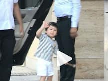 WATCH: Taimur Ali Khan gives a ROYAL WAVE to the paparazzi melting our hearts!