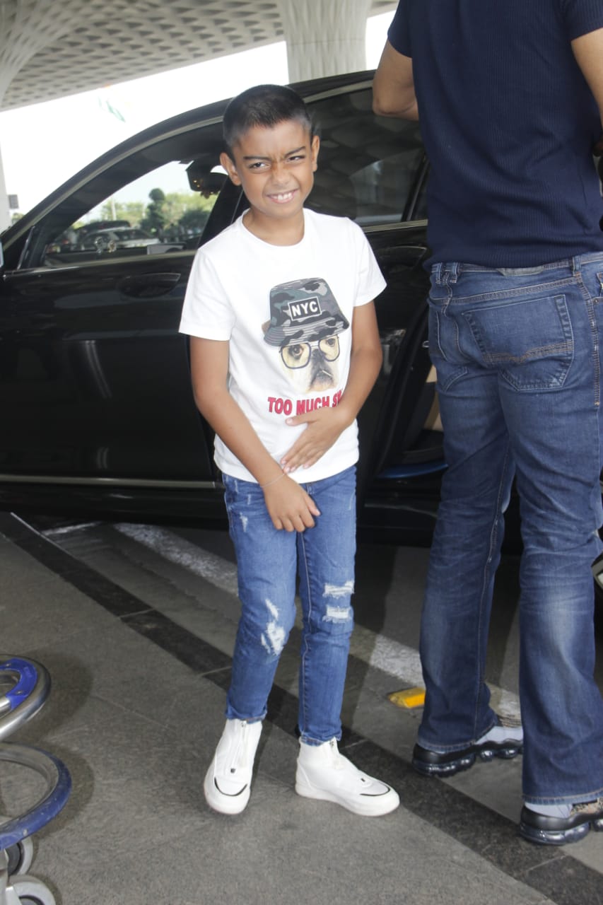 Watch: Ajay Devgn's little son Yug gets irritated by Paparazzi lights at Mumbai airport; SEE PICS & VIDEO