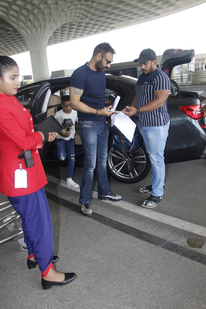 Watch: Ajay Devgn's little son Yug gets irritated by Paparazzi lights at Mumbai airport; SEE PICS & VIDEO