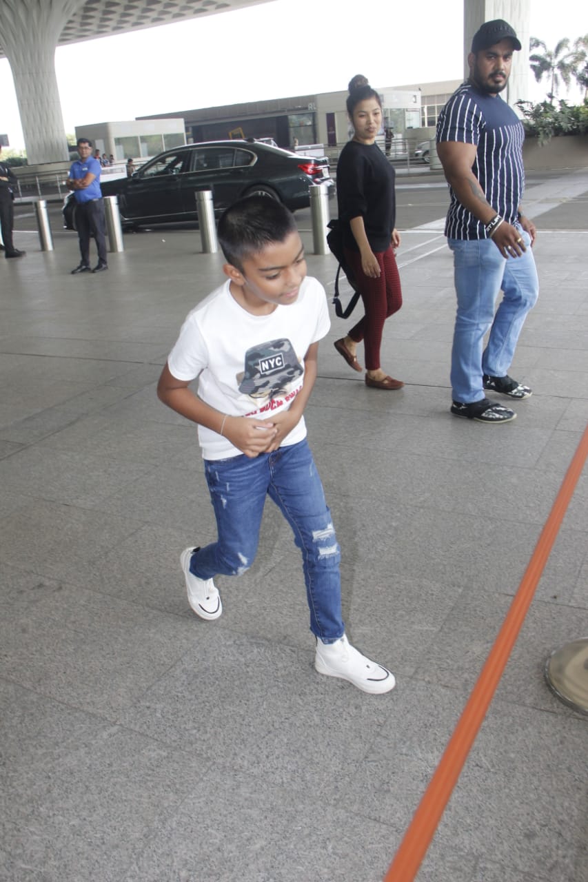 Watch: Ajay Devgn's little son Yug gets irritated by Paparazzi lights at Mumbai airport; SEE PICS & VIDEO