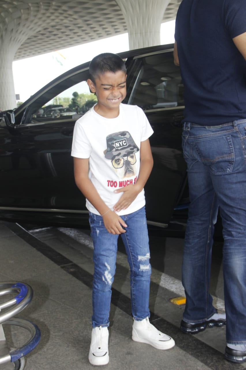 Watch: Ajay Devgn's little son Yug gets irritated by Paparazzi lights at Mumbai airport; SEE PICS & VIDEO