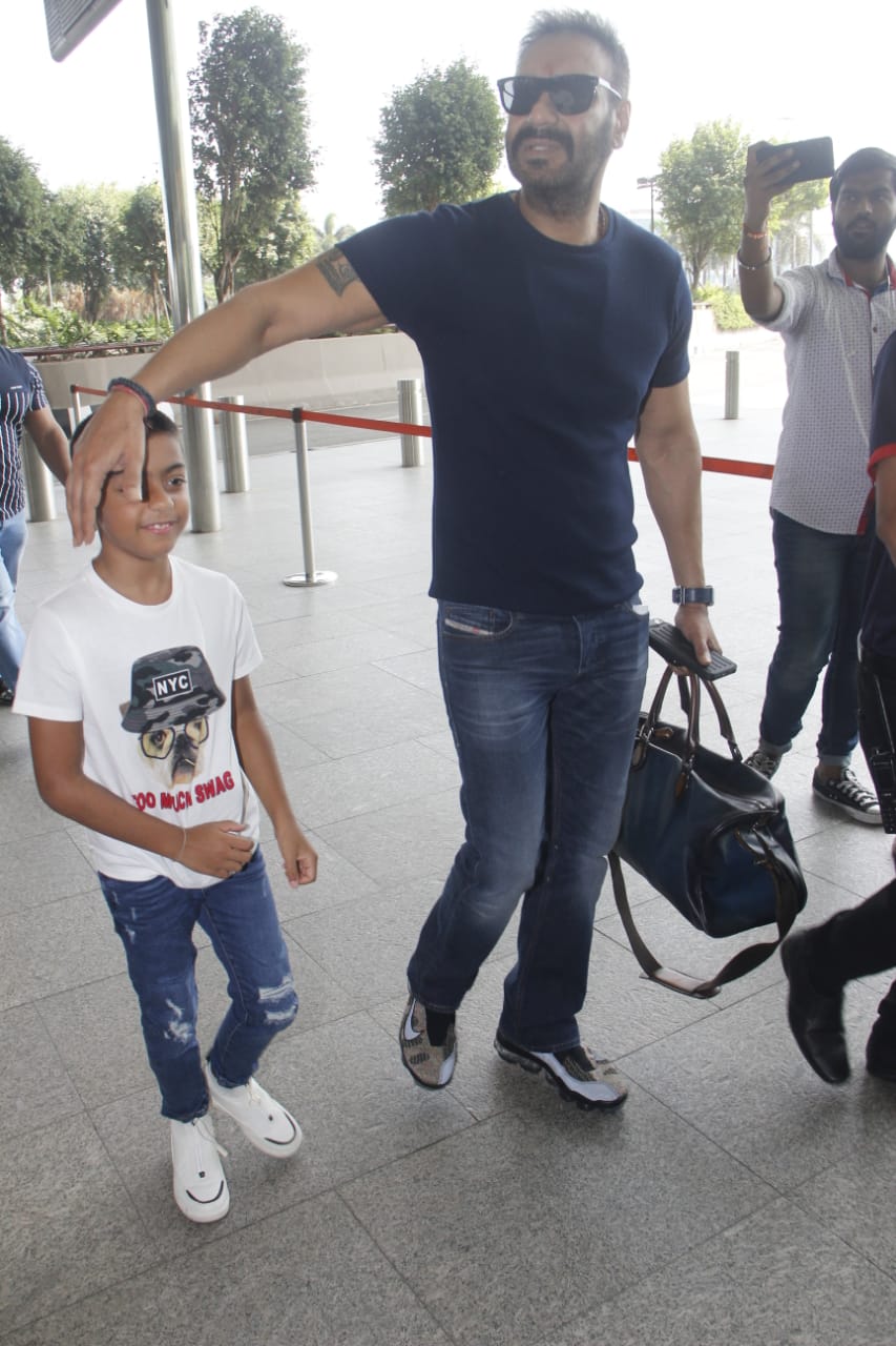 Watch: Ajay Devgn's little son Yug gets irritated by Paparazzi lights at Mumbai airport; SEE PICS & VIDEO