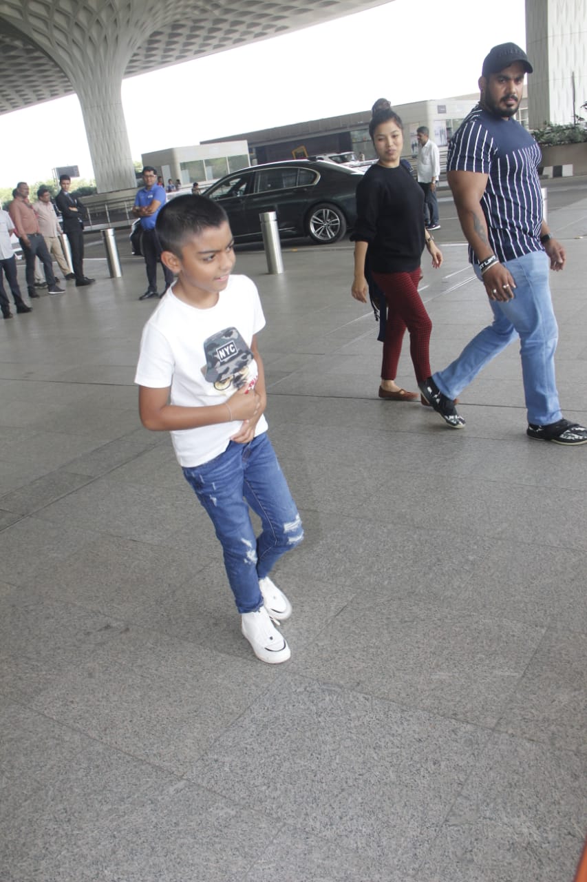 Watch: Ajay Devgn's little son Yug gets irritated by Paparazzi lights at Mumbai airport; SEE PICS & VIDEO