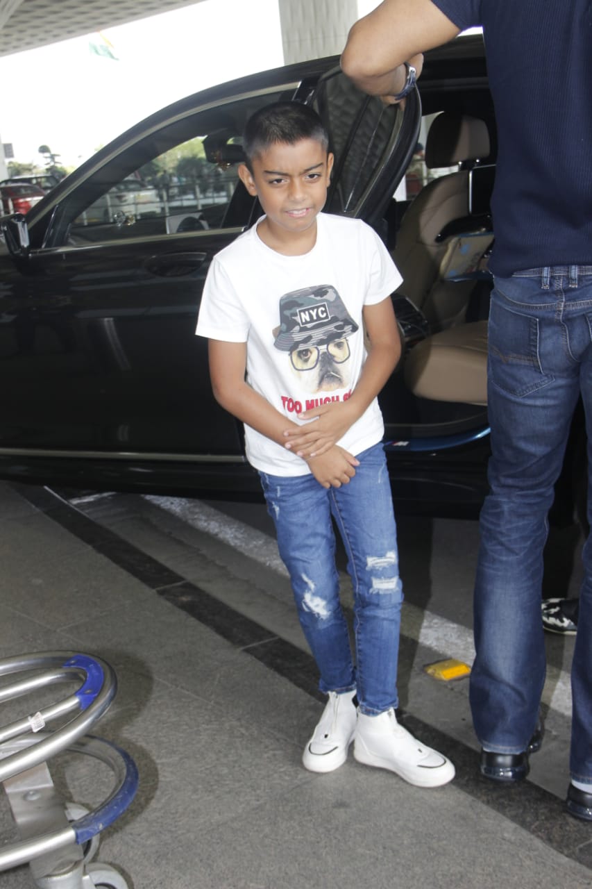 Watch: Ajay Devgn's little son Yug gets irritated by Paparazzi lights at Mumbai airport; SEE PICS & VIDEO