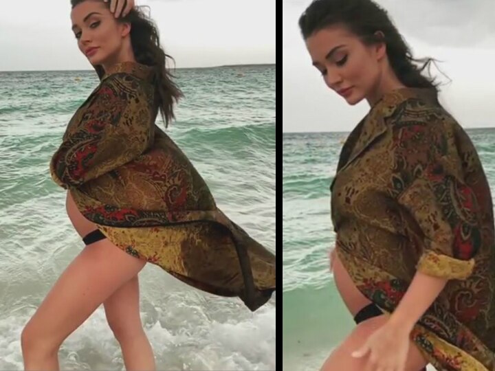 Pregnant Amy Jackson posts a fresh video adorably flaunting baby bump on the beach in a bikini! Pregnant Amy Jackson posts a fresh video adorably flaunting baby bump on the beach in a bikini!