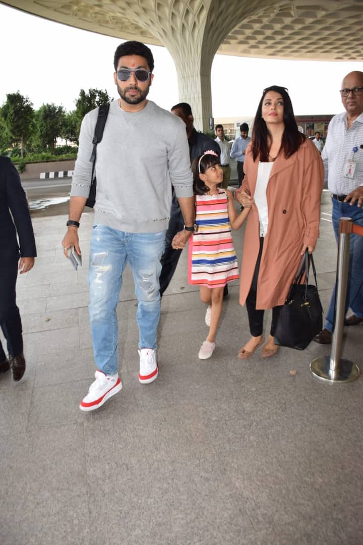 Later Abhishek too held his daughter's hand as they made their way inside the airport
