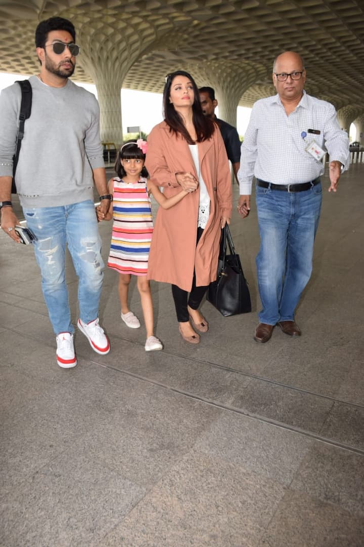 While Abhishek was in his casuals rocking ripped denim and grey sweatshirt and white sneakers, Aishwarya opted for a stylish airport look 