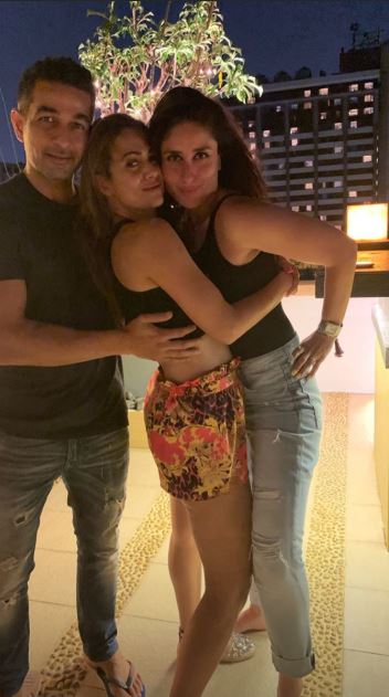 AHEM! Actress Amrita Arora locks lips with hubby at her terrace party with Kareena Kapoor & her girl gang!