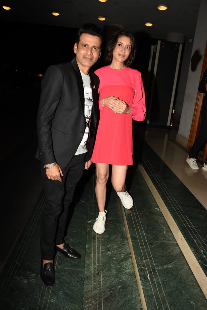 While Manoj Bajpayee looked dapper in a black suit, paired with a white t-shirt, his wife Neha, looked elegant in a short pink dress, teamed up with white sneakers.