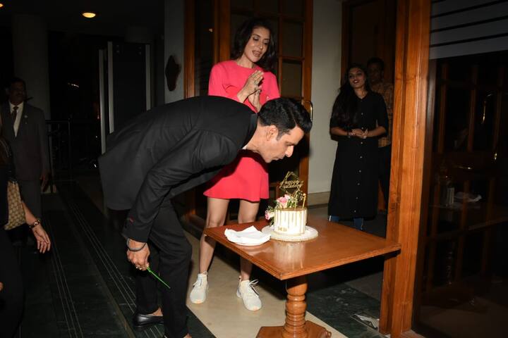 The actor blowing candles as wife Neha claps