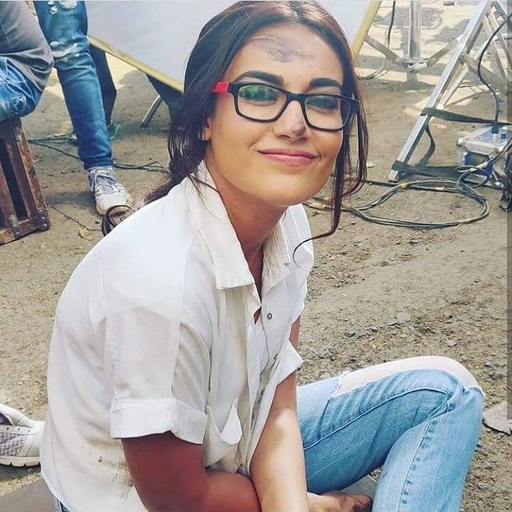Surbhi Jyoti's another look as reincarnated 'Naagrani Bela' post 24 years leap donning a white shirt with blue denims and ofcourse the spectacles can't be missed. What are those dust marks all about on her face, is something the fans would really like to know.