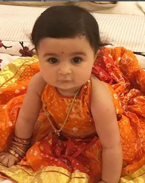Nurvi looks like a doll in her little orange dress, isn’t it? Her daddy had shared the photo from Ashtahami Kanjaka Poojan on social media.