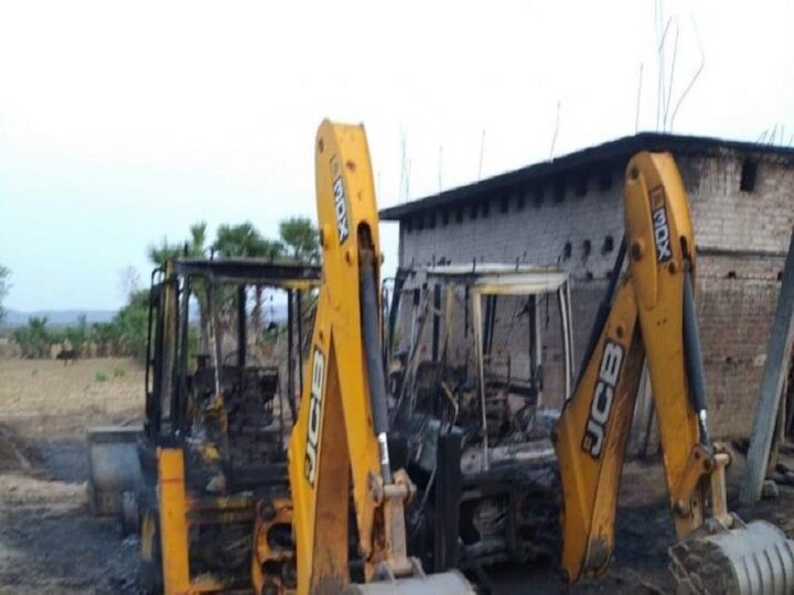 Naxals torch four vehicles engaged in road construction work in Gaya Naxals torch four vehicles engaged in road construction work in Gaya