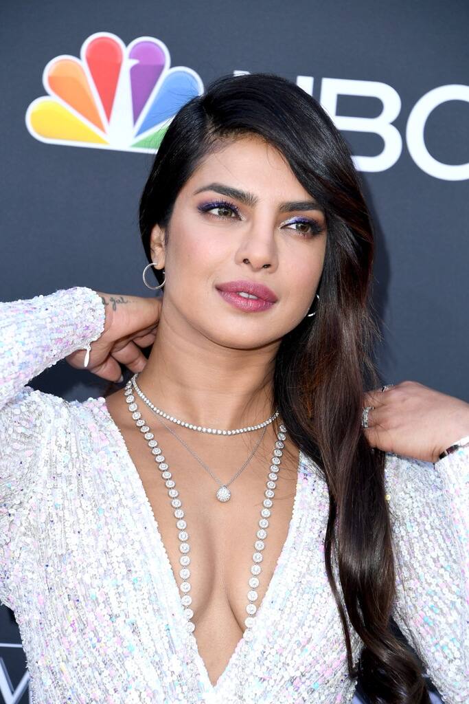 The Quantico star let layers of diamonds sweep down into her cleavage for maximum glamour