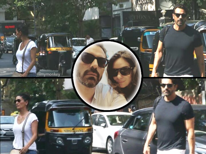 Arjun Rampal spotted with wife Mehr Jessia outside a bank post announcement of girlfriend Gabriella's pregnancy Arjun Rampal visits wife Mehr Jessia post announcement of girlfriend Gabriel's pregnancy