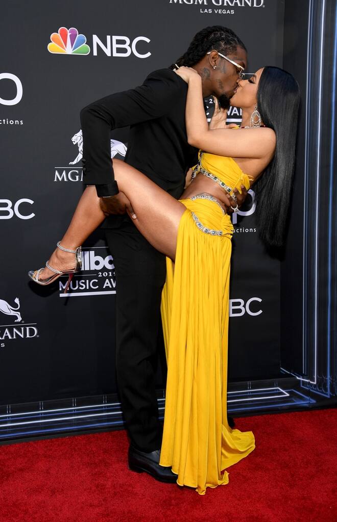 The passionate moment Cardi and her husband Offset shared in front of photographers got more attention than their stunning looks. 