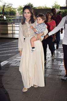 These PHOTOS of yummy mummy Sunny Leone and her TWINS clicked at the airport will make you go AWW!