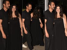 IN PICS: Arjun Rampal\'s pregnant girlfriend Gabriella flaunts her BABY BUMP as the couple TWIN in Black at a party!