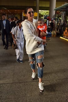 PHOTOS: Sania Mirza nails mommy fashion as she gets PAPPED with BABY SON Izhaan Mirza Malik at the airport!